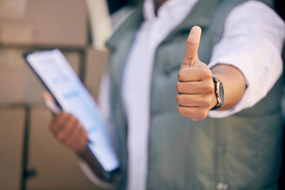 Delivery professional showing thumbs up Satti Services