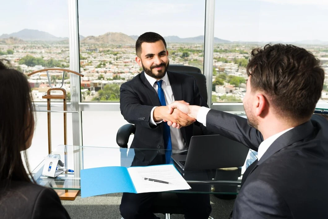 Businessmen shaking hands after a successful meeting.