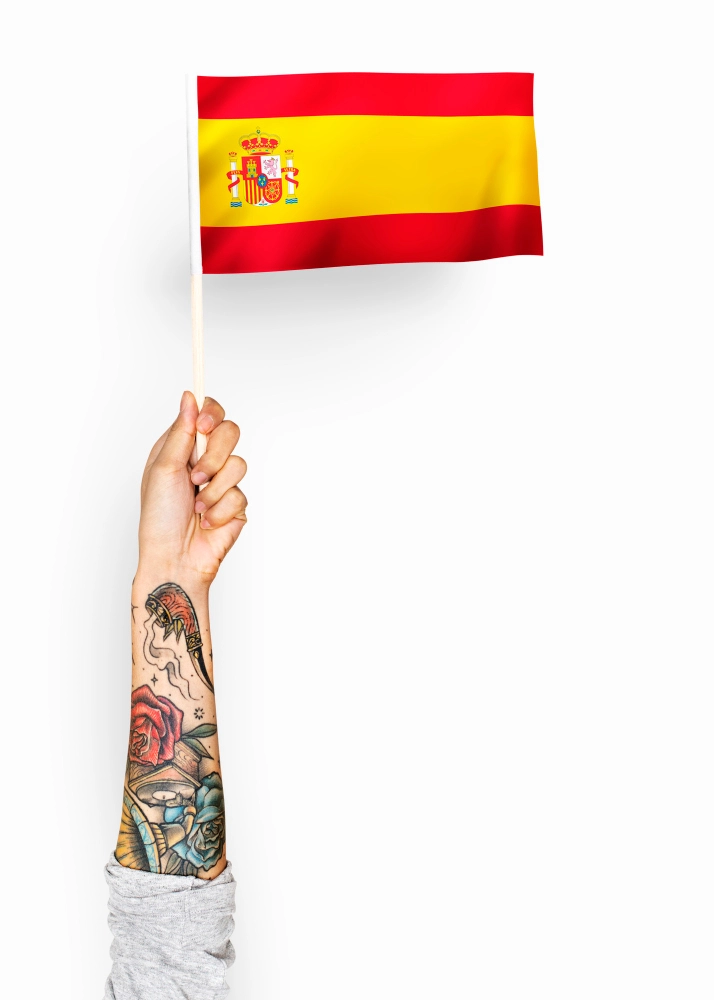 Hand holding Spanish flag